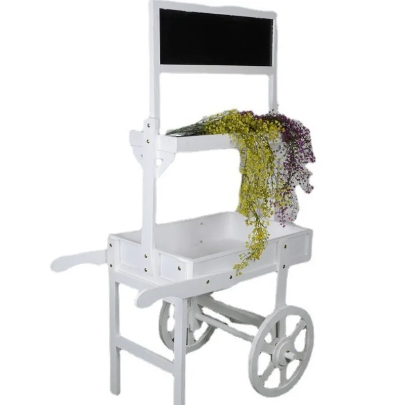 Old wood, floor-to-ceiling ornaments, soft ornaments, fresh blackboard flower stands in the window, with wheels