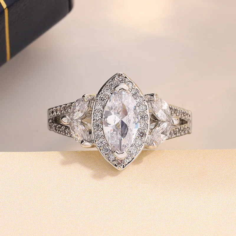 

Изысканное женское кольцо маркизы с белым цирконом, посеребренное 925, идеально подходит для вечеринок, свадеб, дней рождения и ювелирных подарков