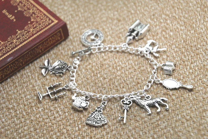 

12pcs Beauty and The Beast Inspired Bracelet Clock Castle Horse Book Mirror Wolf Crown Key Charm