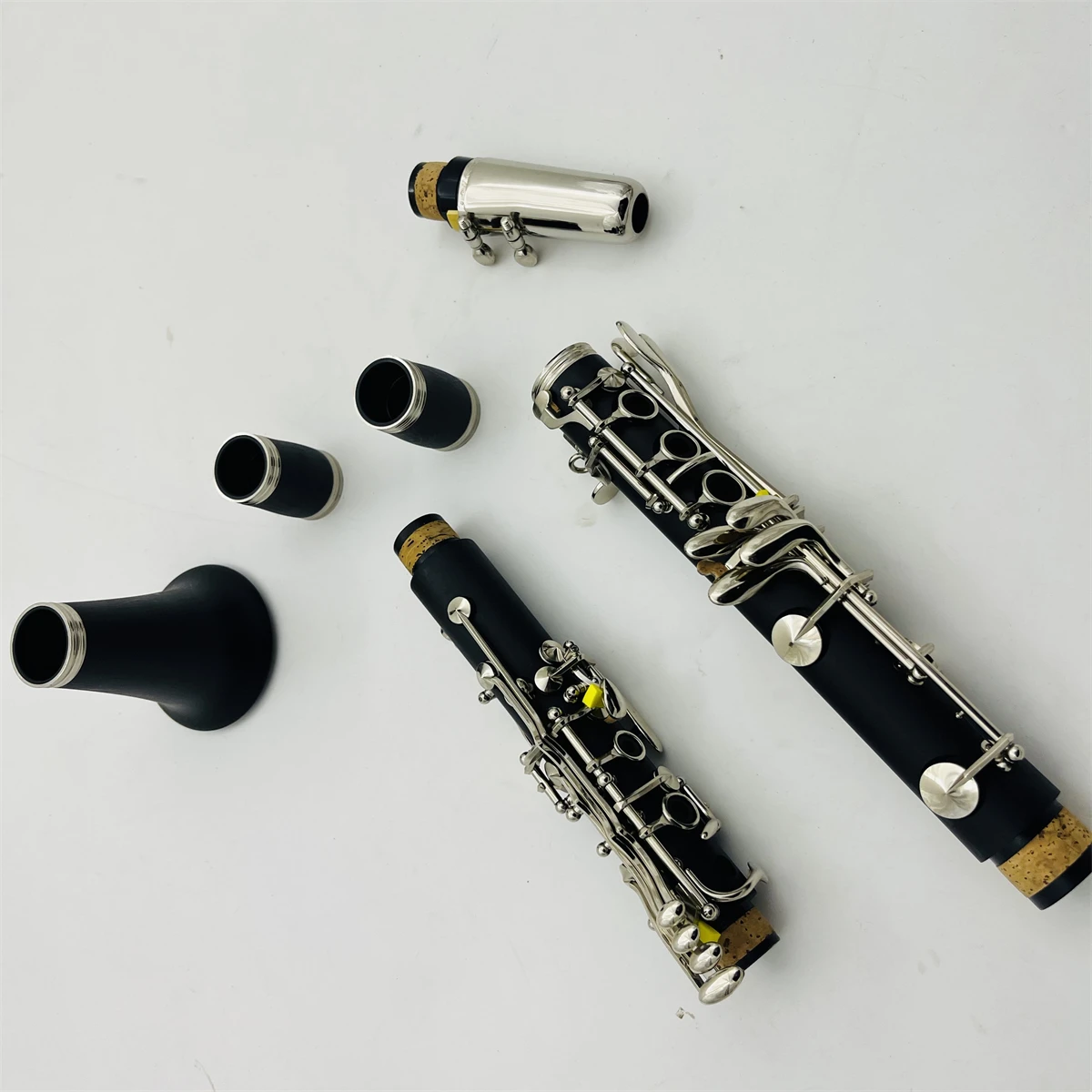Fotos reales clarinete de madera de baquelita C Tune 17 teclas instrumento musical profesional con estuche