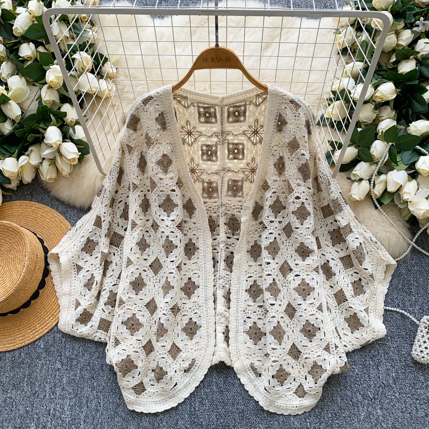 2025 primavera outono beira-mar férias malha cardigan feminino manga morcego solto boêmio oco crochê design proteção solar topo