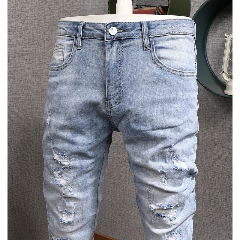 

Light colored casual jeans for men, slim fit with small feet and elastic Korean style trendy and versatile casual ripped pants