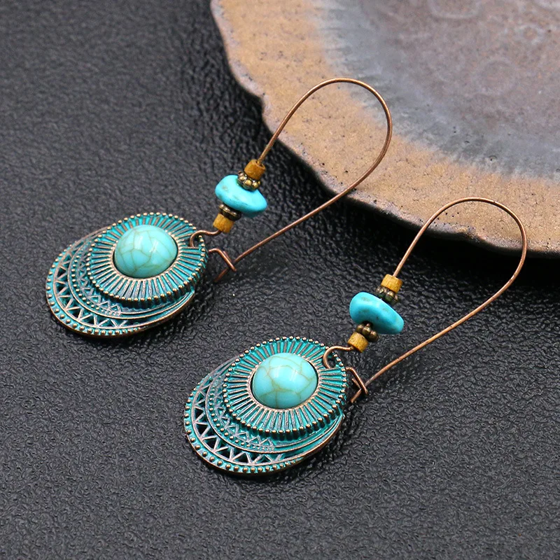 Design inspired turquoise metal earrings with multiple layers of circular hollow carvings trendy and versatile earrings