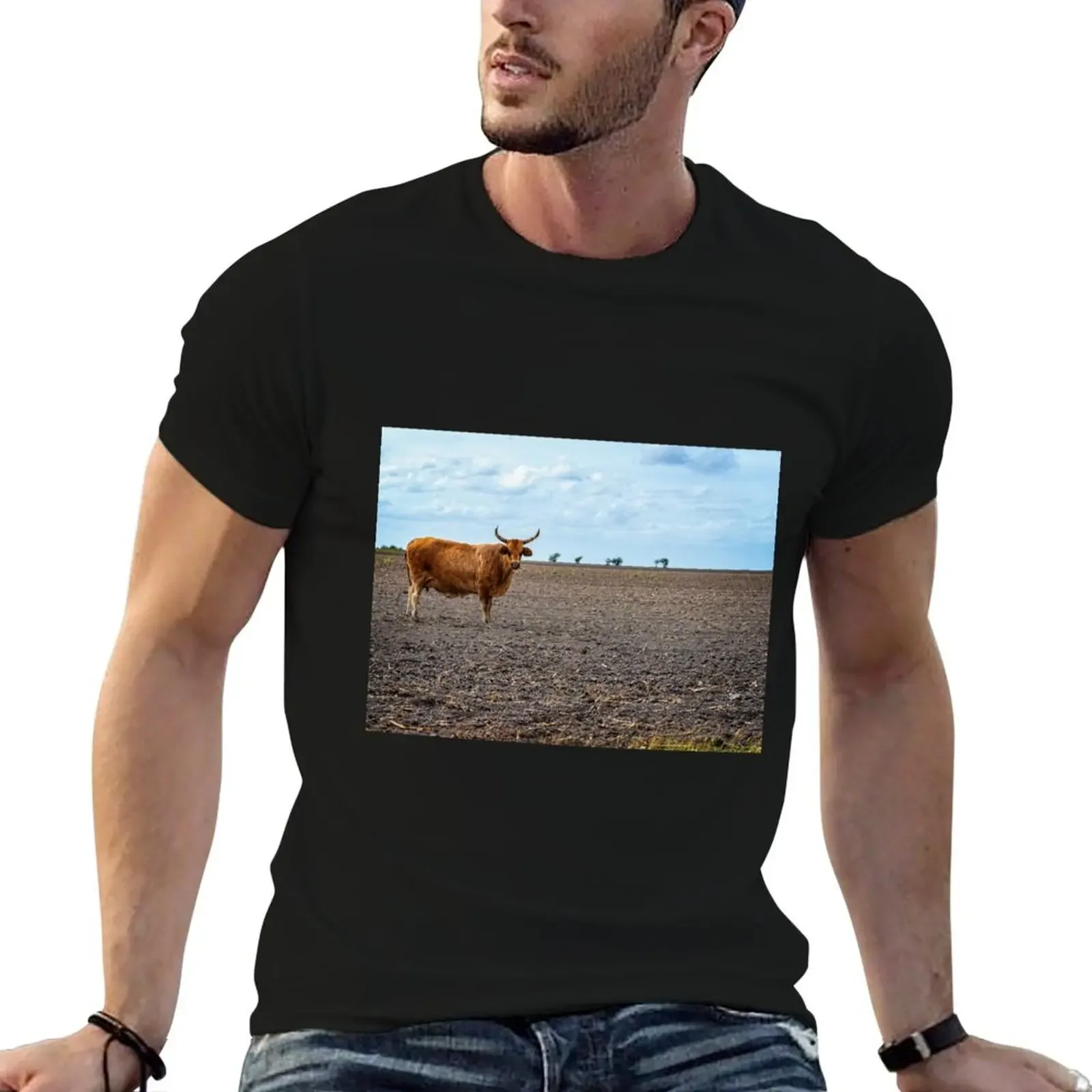 Cow with horns standing in empty pasture T-Shirt boys whites anime tshirt custom t shirt mens cotton t shirts