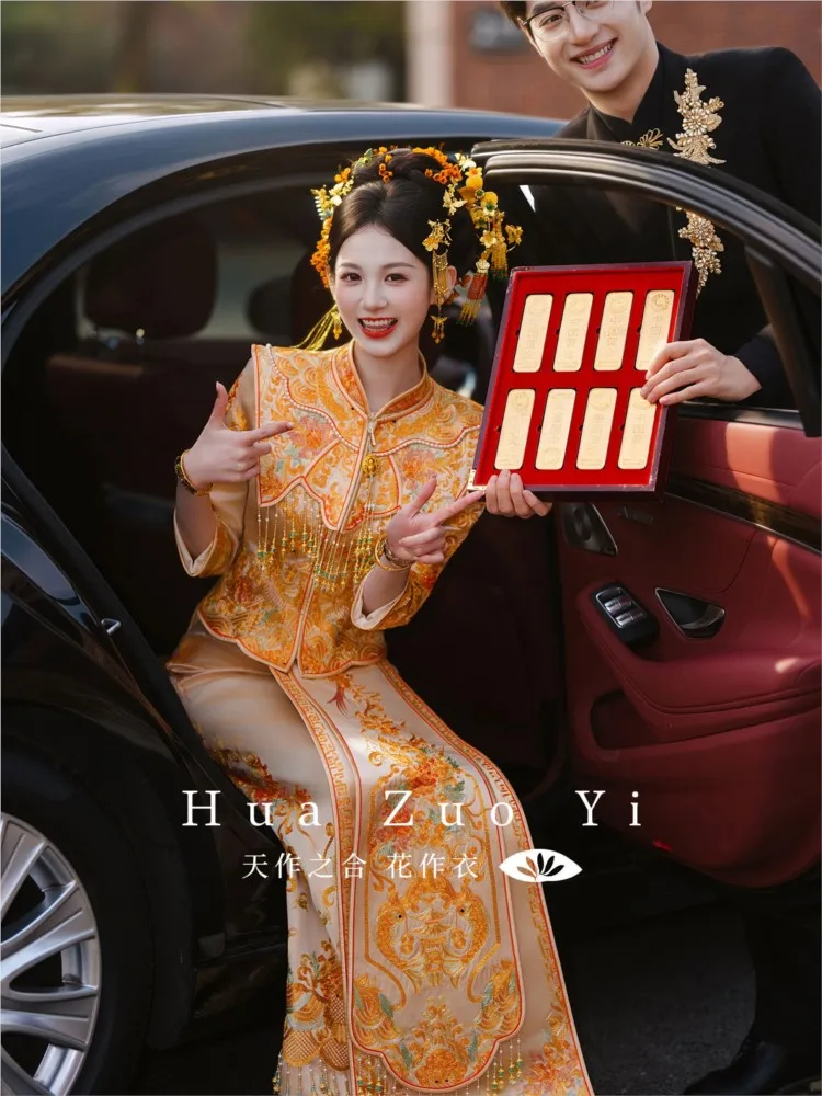 The Chinese-style dragon and phoenix gown is embroidered as a wedding dress