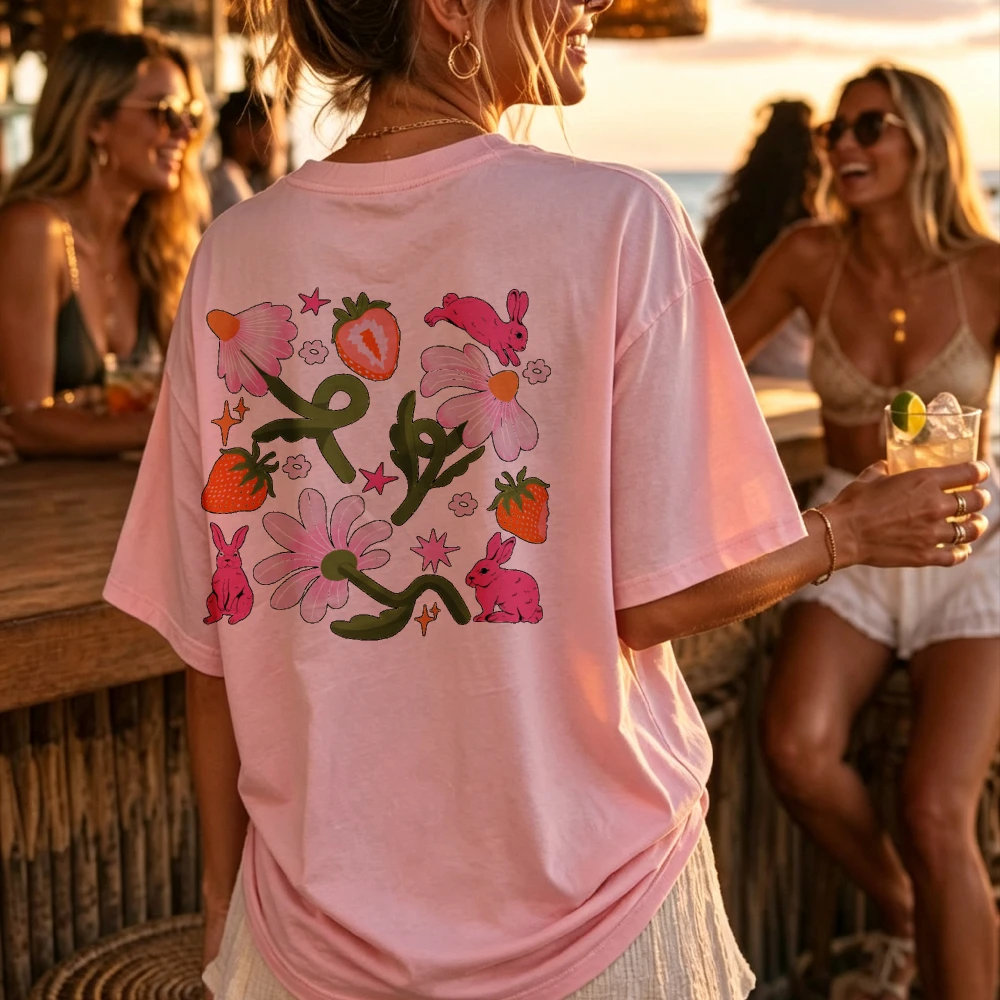 Whimsical Floral Pattern Pink Rabbits Strawberries Daisies Stars Green Vines Pastel Pink Fit Crew Neck Short Sleeves Cotton Tops