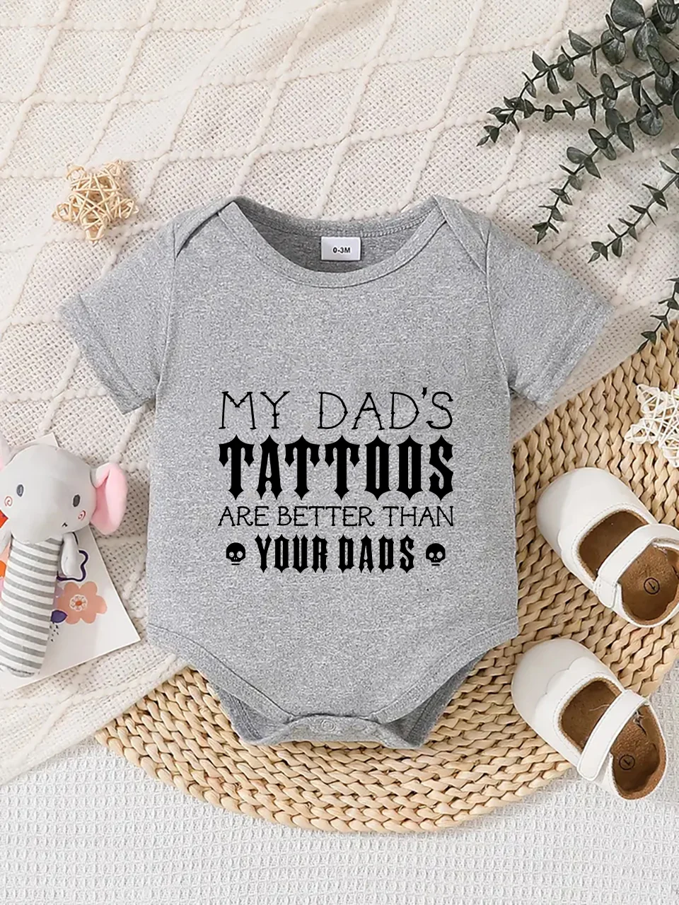 Playful letter-printed baby short-sleeve triangle bodysuit. Button closure for easy dressing, machine washable
