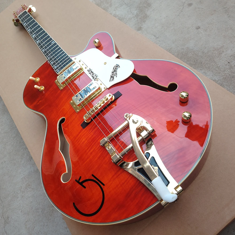 High quality orange red flame maple top electric guitar, dual f-holes, large vibrato system, in stock for quick delivery