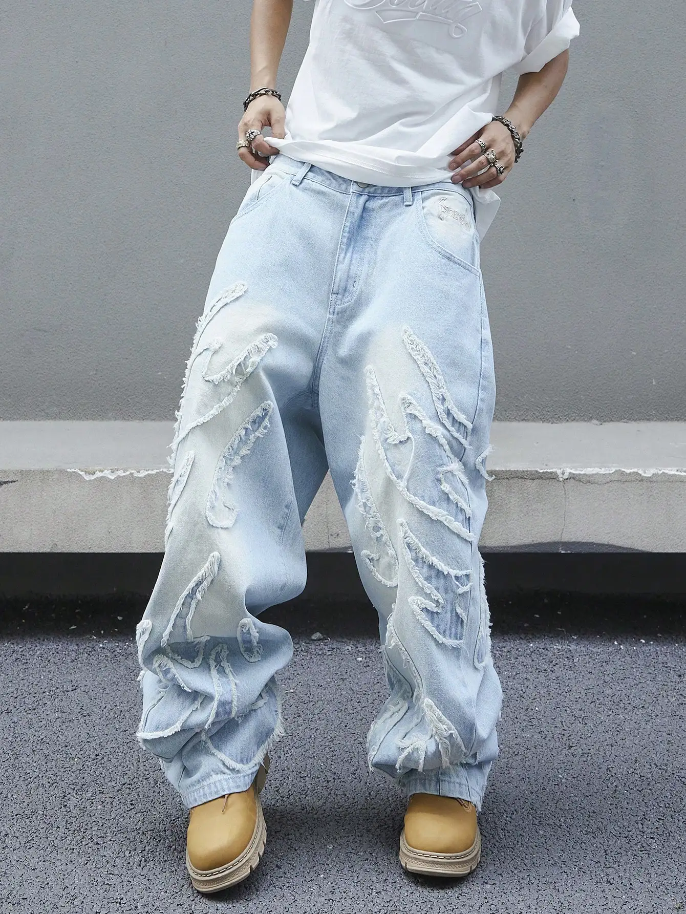 

Men's trendy and cool denim wide-leg pants for all seasons featuring unique patchwork patterns, light blue street-stunning style