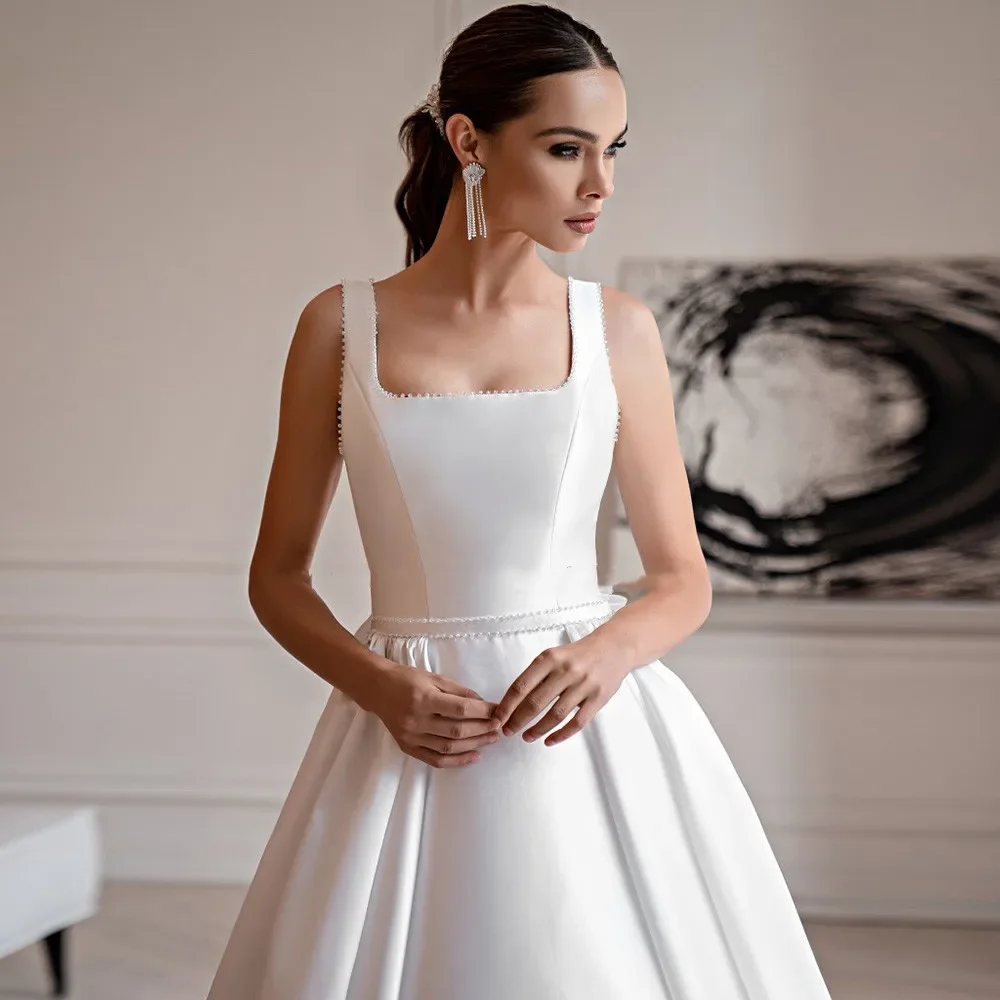 Abiti da sposa eleganti svasati 2024 abito da ballo con collo quadrato perle abito da sposa senza maniche cintura con fiocco abito da sposa classico con lacci