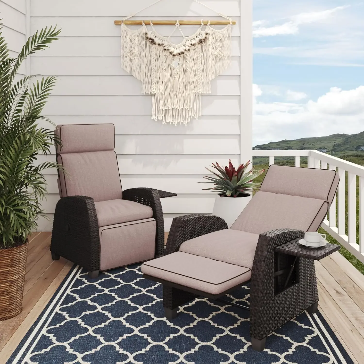 A set of 2 outdoor lounge chairs on the large terrace, with willow branches laid flat and flip side tables