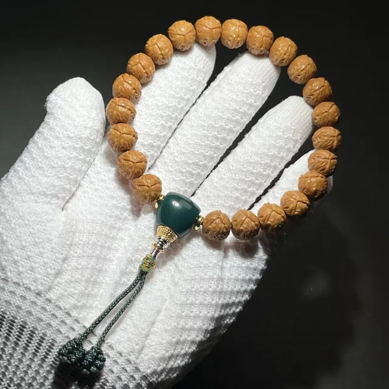Exquisitely crafted monkey carving, large with rough edges, small walnut beads, each one carefully selected