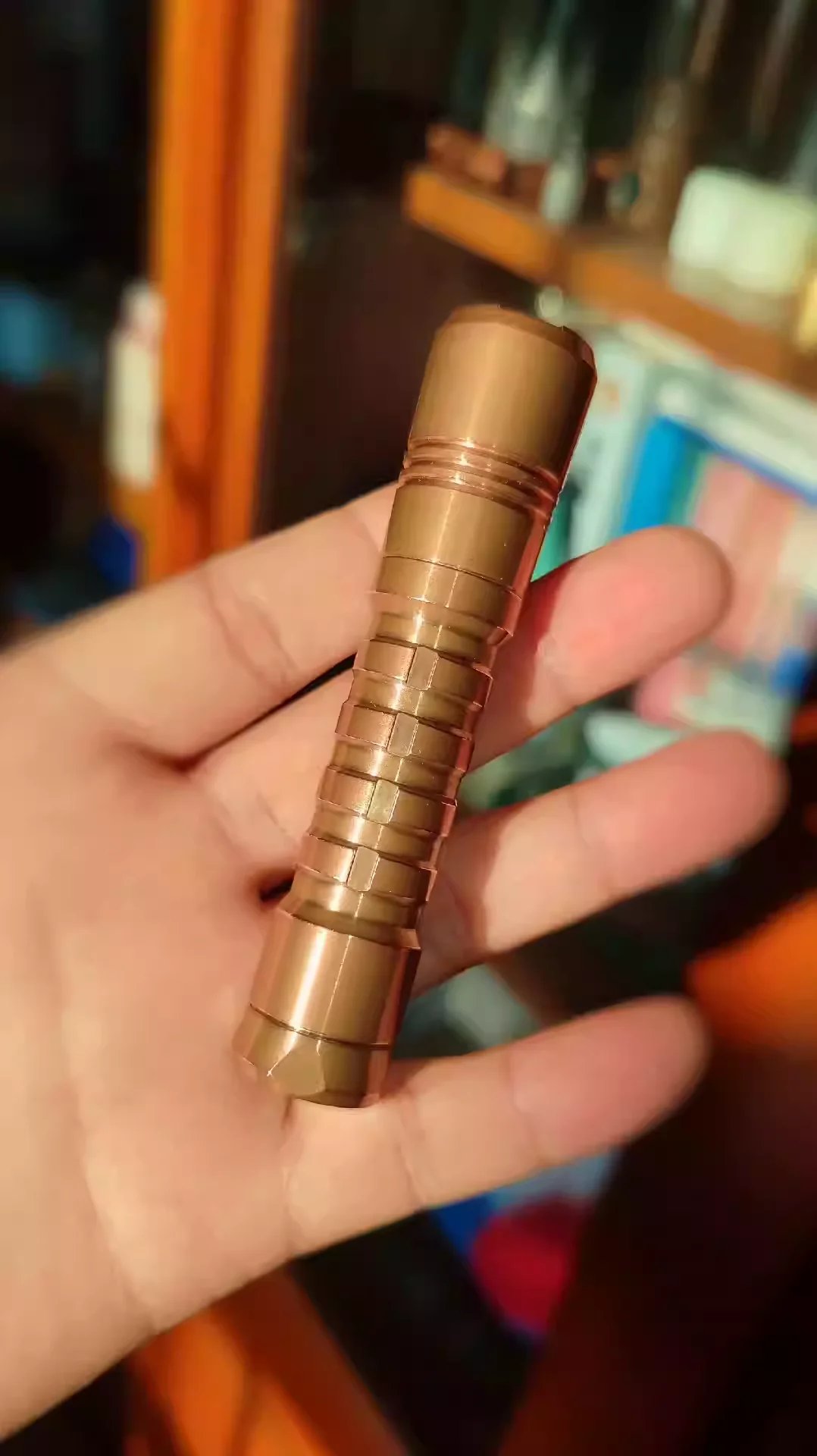 Reylight copper pineapple flashlight. AA level cylinder, supports lithium battery, and has a great tactile feel