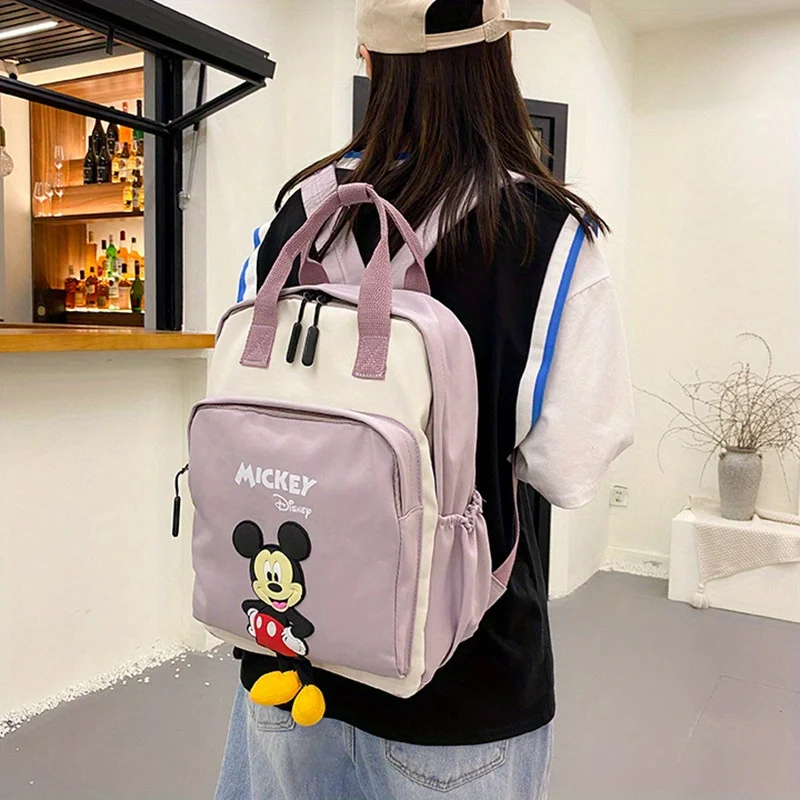 Mochila de dibujos animados, tela impermeable de nailon, colgante de Mickey, bolso de mano adecuado, 1 unidad