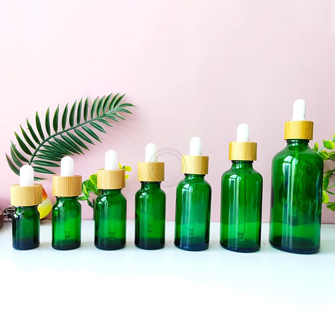 Whosesale frascos de garrafa conta-gotas de vidro âmbar/verde/azul/preto de alta qualidade com tampa de bambu pipeta para garrafas de perfumes cosméticos