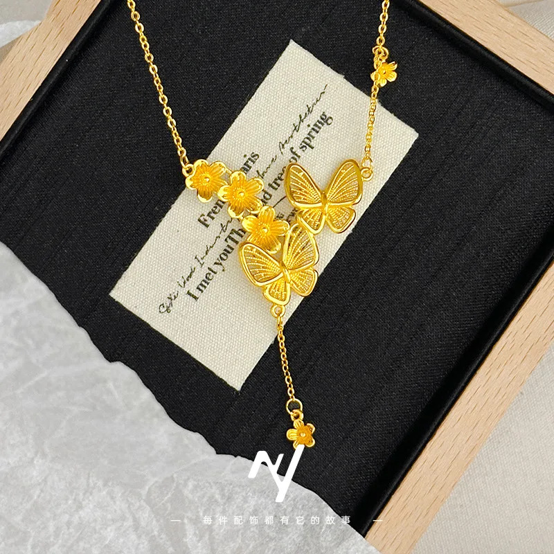 

A genuine gold 999 Chinese-style three-flower butterfly tassel necklace with a niche design and collarbone chain