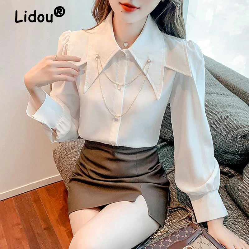 

2022 Spring Summer New Korean Pointed Collar Puff Sleeve White Shirt Long Sleeve Metal Chain Solid Blouse Women's Casual Shirt