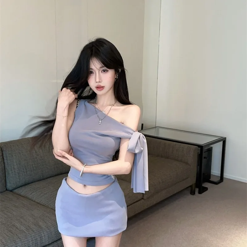 

Сексуальный летний новый комплект с косыми плечами для девочек, топ с нерегулярными плечами, дизайнерская юбка, женский комплект Faion