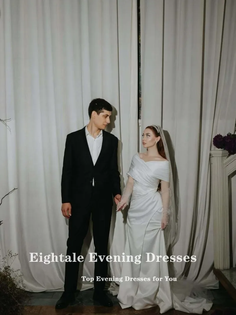 ชุดแต่งงานแบบอาหรับสีขาวงาช้าง ทรงเมอร์เมด ผ้าซาติน แบบเปิดไหล่ จีบระบาย  รับตัดตามสั่ง