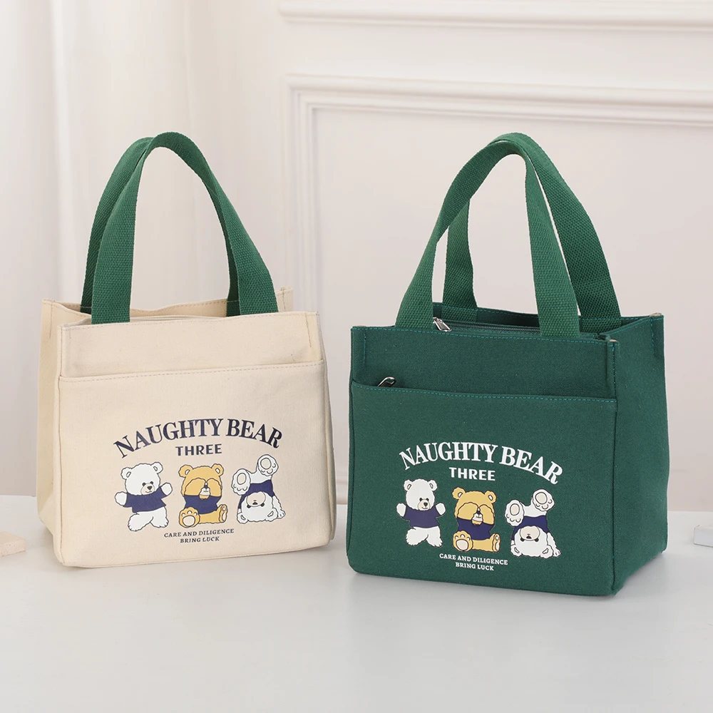

Japanese-style minimalist, versatile, casual commuting canvas tote bag with cartoonish design for students and office use