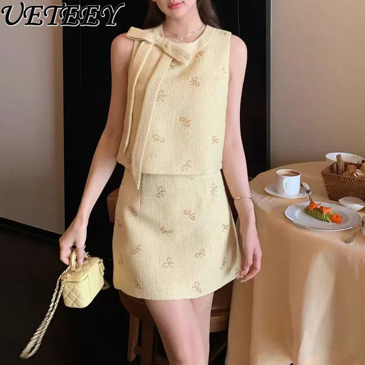 

Summer Retro Round Neck Heavy Industry Decorative Sleeveless Bow Vest Top and High Waist A-shaped Short Skirt Two-piece Set