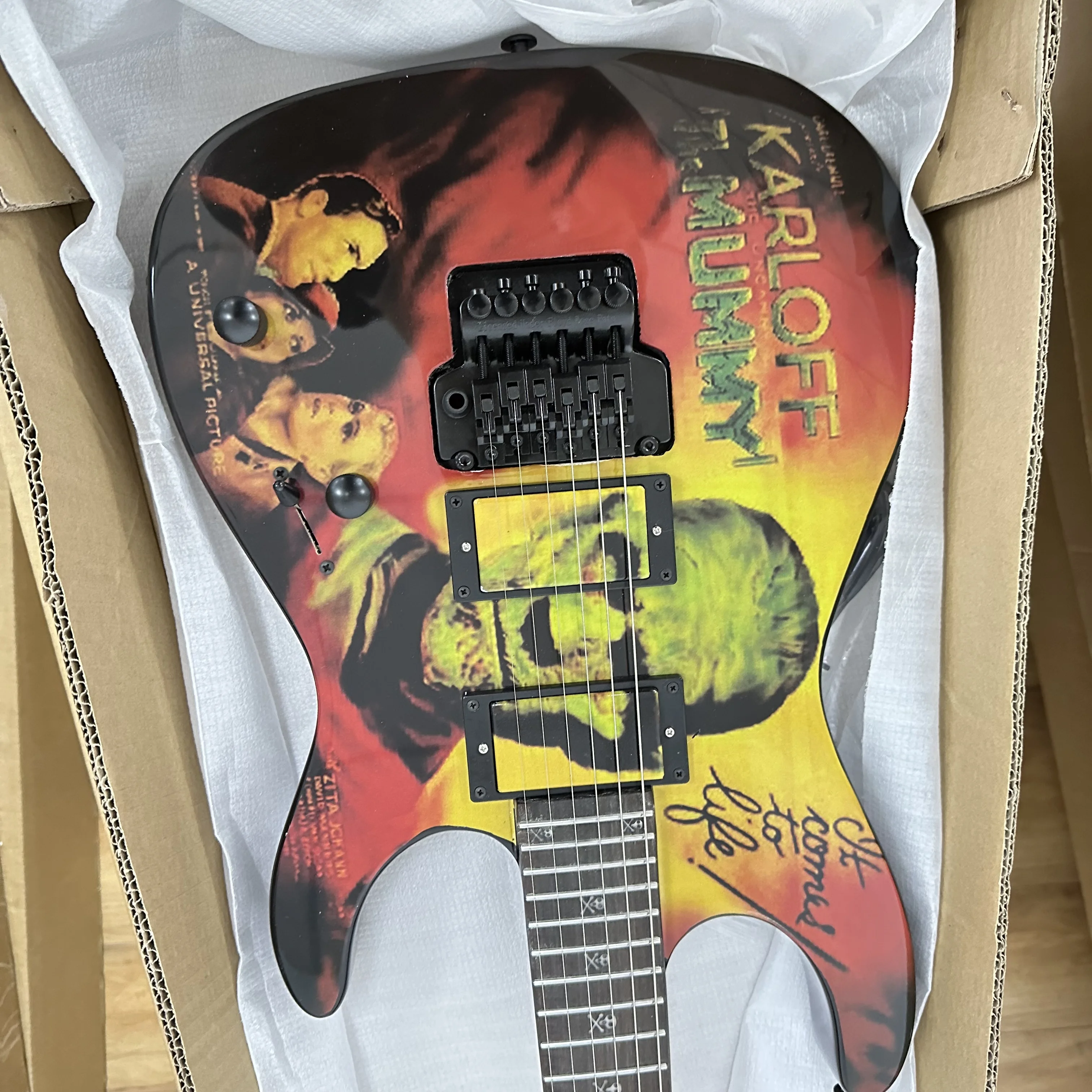 2026 New Horror Movie Print Electric Guitar-Vintage Mummy Poster Graphic Double Lock Tremolo Dual Humbucker - Alder Body Rosewood Fretboard Christmas Gift American Warehouse Free Shipping