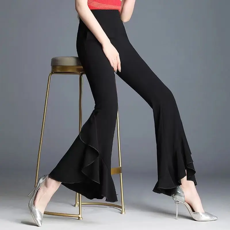 Primavera outono nova cor sólida moda cintura elástica bell-bottoms feminino high street cintura alta babados retalhos calças all-match