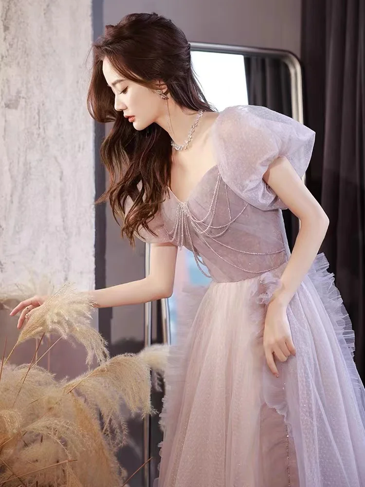 Splendido abito da sera viola rosa Elegante abito da festa formale da donna lungo con perline e maniche a sbuffo in tulle sexy senza schienale con lacci