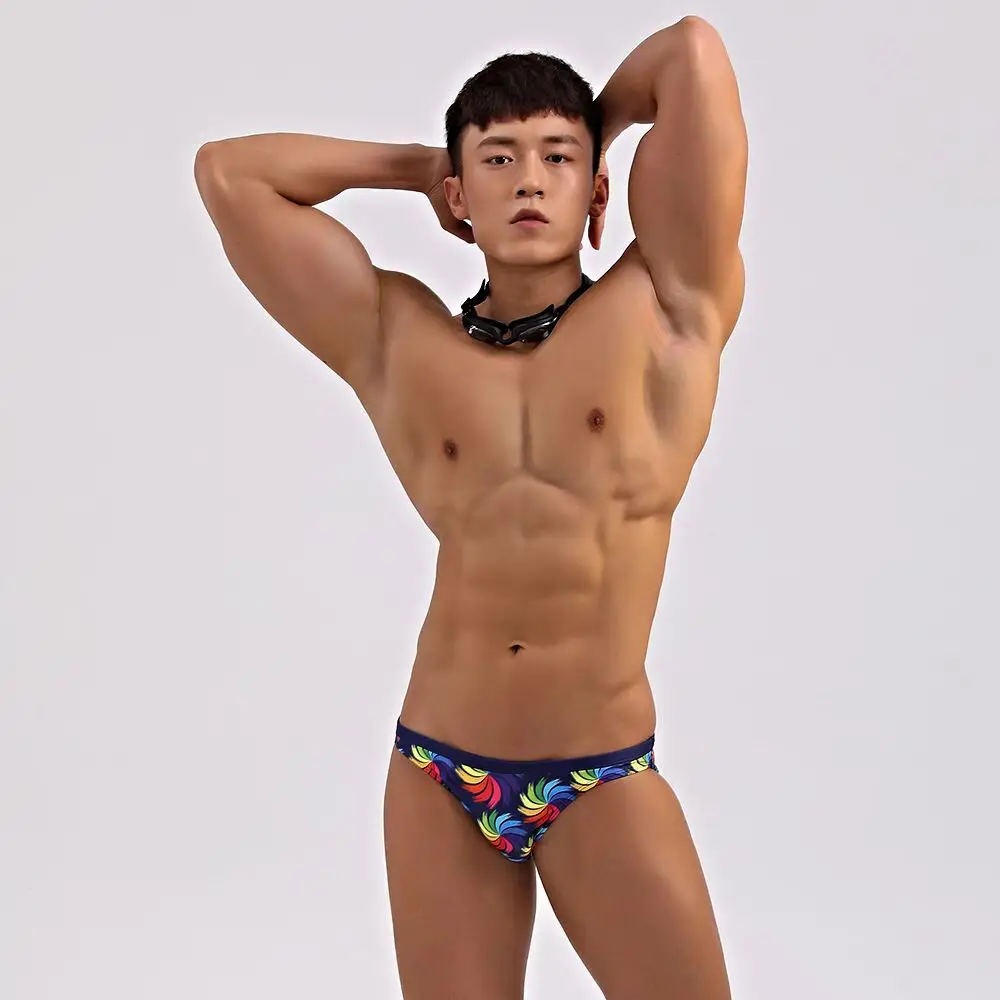 

new Man triangle swimming trunks with low waist half wrapped buttocks narrow edge sexy rainbow swim shorts direct sales 2528