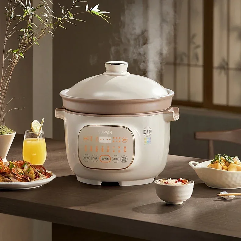 Chinese ceramic electric stew pot. Household appliance Ceramic electric casserole for soup. Smart can do dry baking and braising