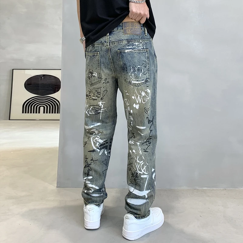 

High Street tapered men's jeans American washed and old personality graffiti spray paint print loose wide-legged pants