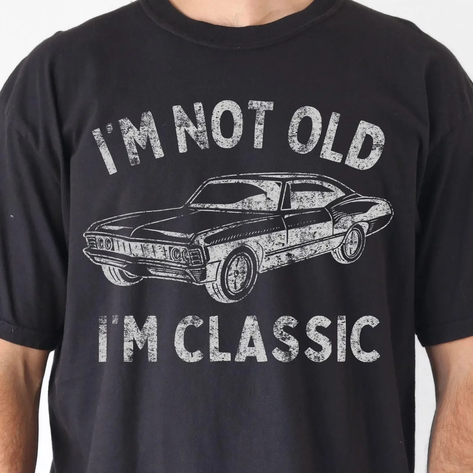 May include Black t shirt with a vintage style graphic of classic car and the text I'm not old vintage Washed Slightly