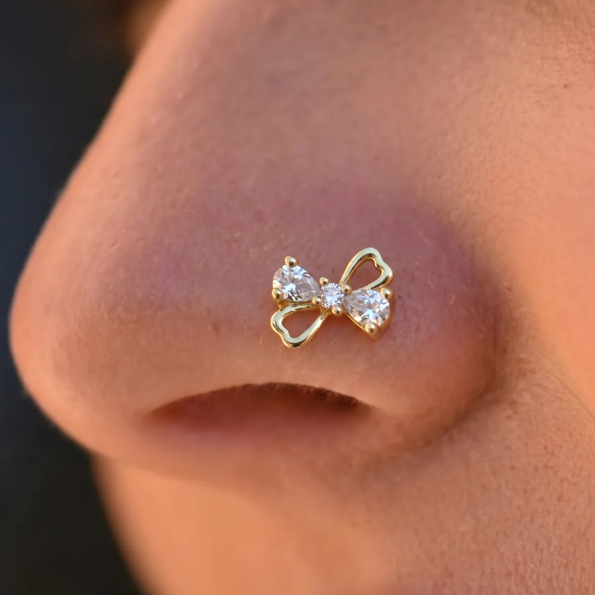 1-piece set of elegant and cute hollow bow, pierced nose nail inlaid with synthetic zircon, women's luxury Japanese and Korean s