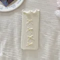 M White