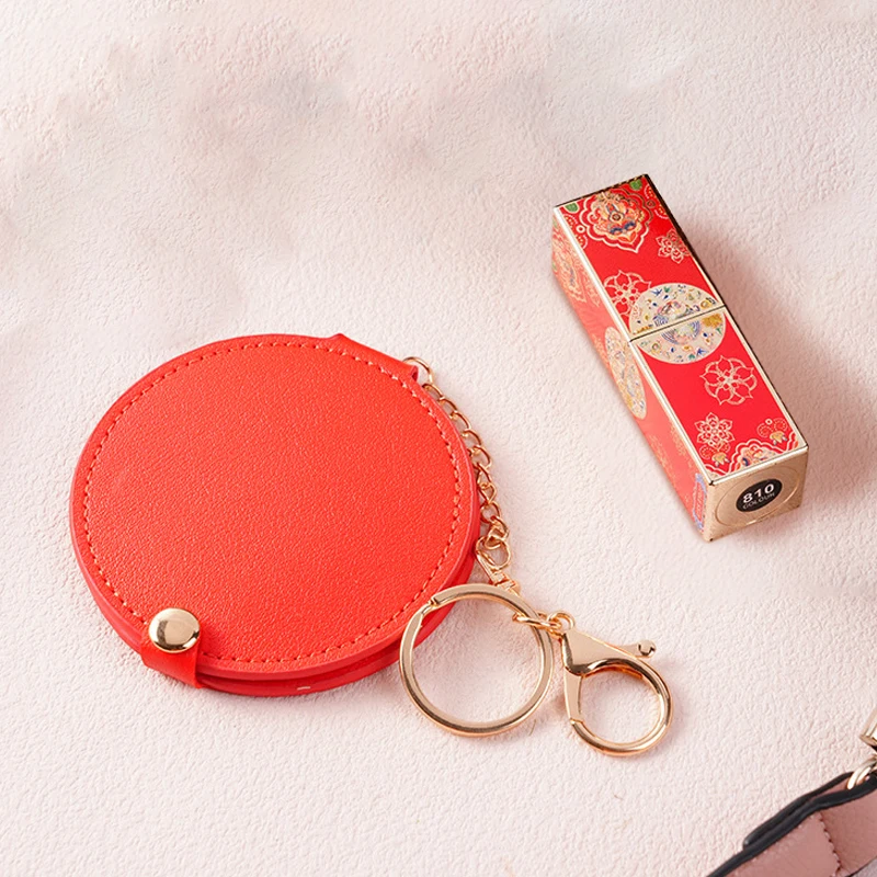 PU-leer Ultradunne ronde make-upspiegel Roestvrij staal Dubbelzijdige cosmetische spiegel Opvouwbare zak Compacte spiegel voor op reis