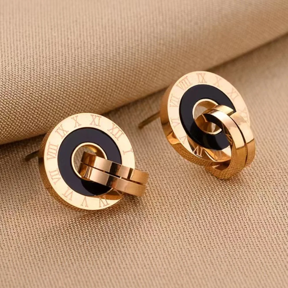 

Vintage women's earrings with metal circular Roman numeral design. A stylish women's stainless steel earring.