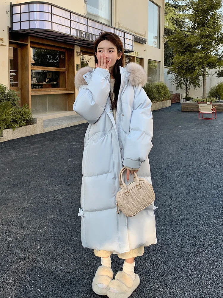 

Genuine Fox Fur Hood. 2025's slim-fit long down coat with premium white duck down. Luxurious warmth.