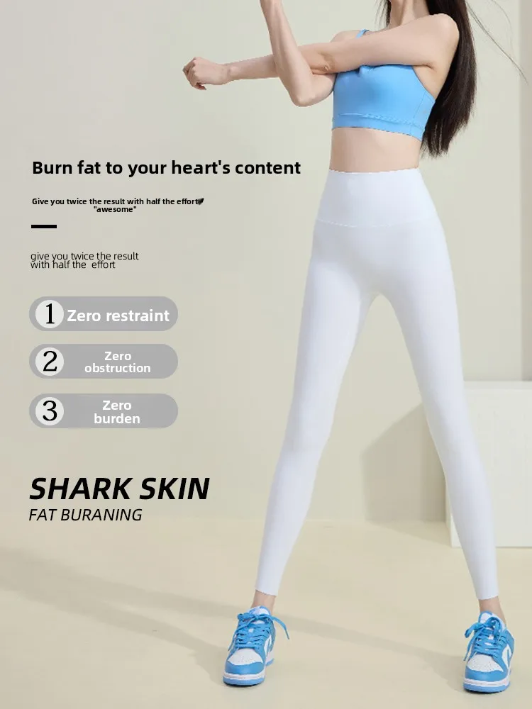 กางเกงโยคะเอวสูงผู้หญิงรุ่นใหม่ปี 2025 ทรงรัดรูป ผ้าหนังอาร์คสกิน ยืดหยุ่นสูง กระชับหน้าท้อง กางเกงพิลาทิสแบบรัดรูป