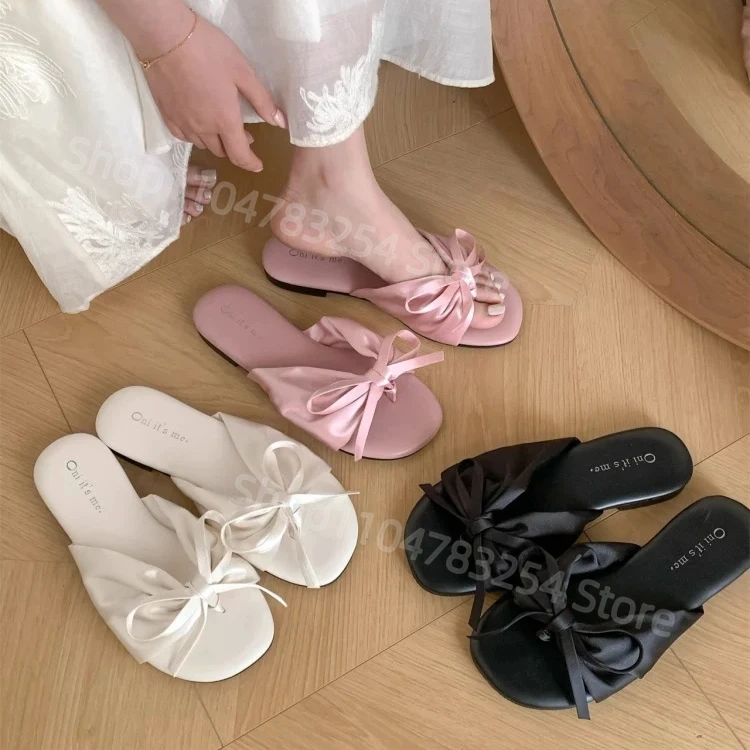 عقدة الصنادل المسطحة المرأة الصيف ملابس خارجية 2025 جديد الجنية مطابقة التنانير نعال شاطئ الكورية Sle كعب منخفض #1