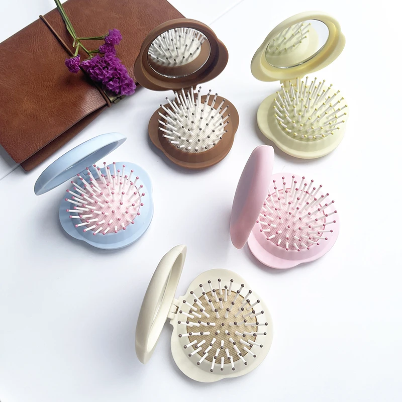 مشط شعر صغير محمول مع مرآة لصالونات تصفيف الشعر، فرشاة شعر صغيرة الحجم قابلة للطي للتدليك 2 في 1، مشط وسادة هوائية