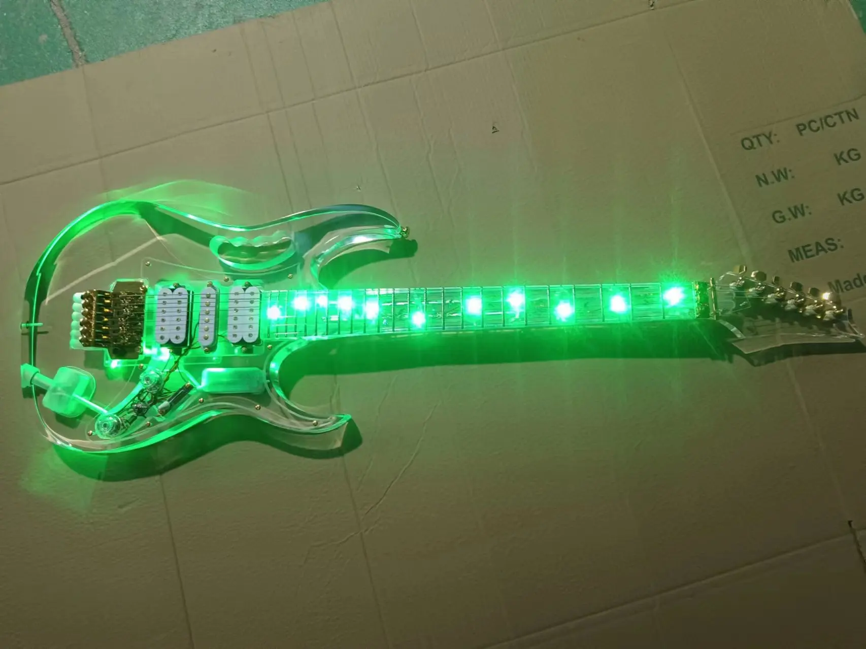 Acrylic electric guitar with green lights, rosewood fretboard, high quality and customizable