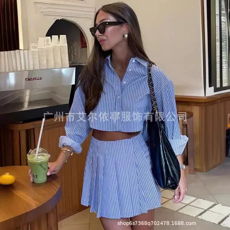 Elegant Blue Striped Women's Two-Piece Set with Stylish Long-Sleeved Buttoned Top and High-Waisted Pleated Skirt