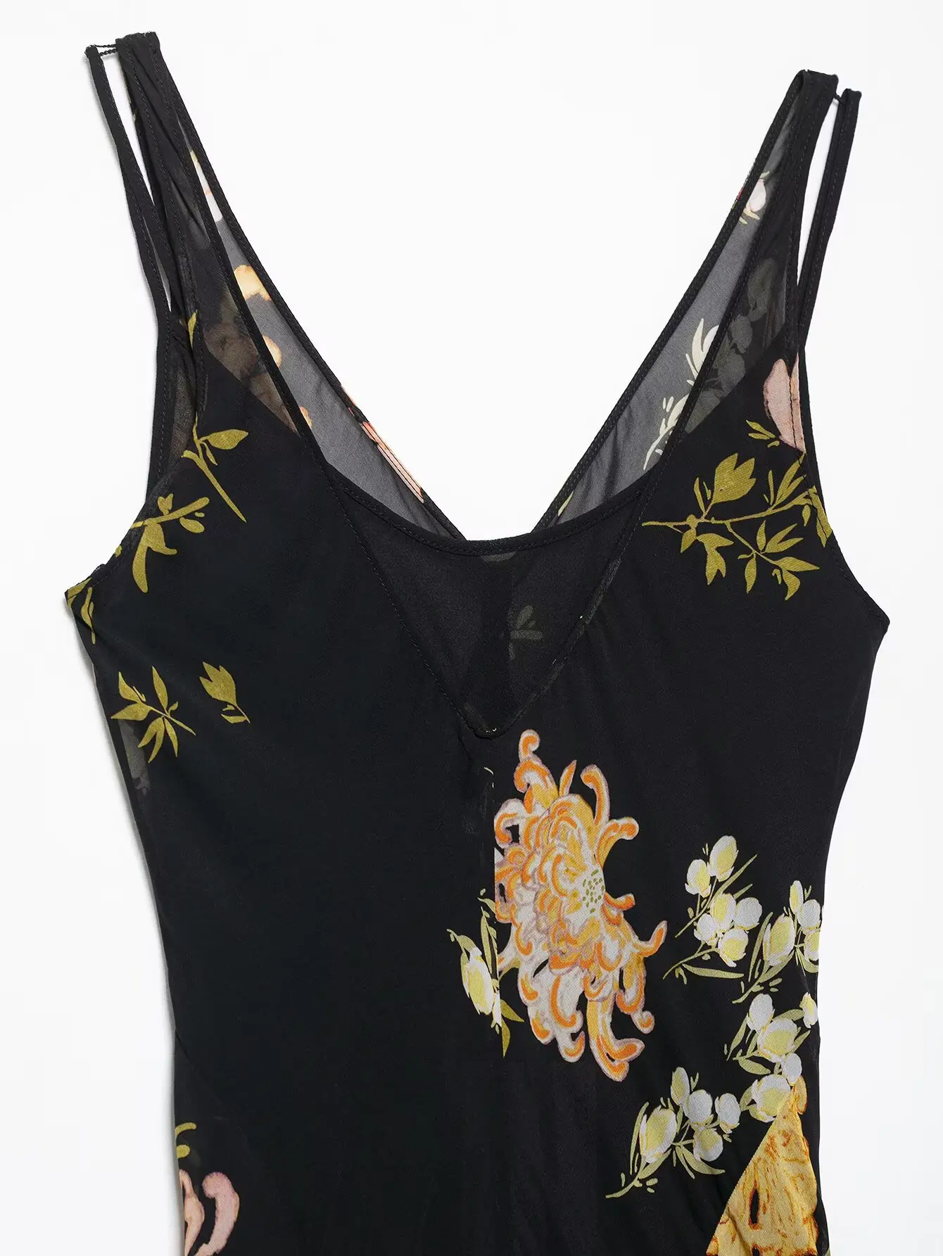   Damska sukienka midi bez rękawów z dekoltem w kształcie litery V, zdobiona kwiatami, rozkloszowana, idealna na lato, zapewniająca szykowny i zwiewny wygląd.