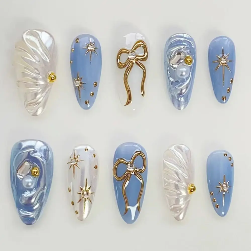 

24pcs Long Almond False Nails French Deep Blue Cat Eye Stripe Press on Nails Golden Sparkling Bow Wave Pearl Starburst Nail Tips