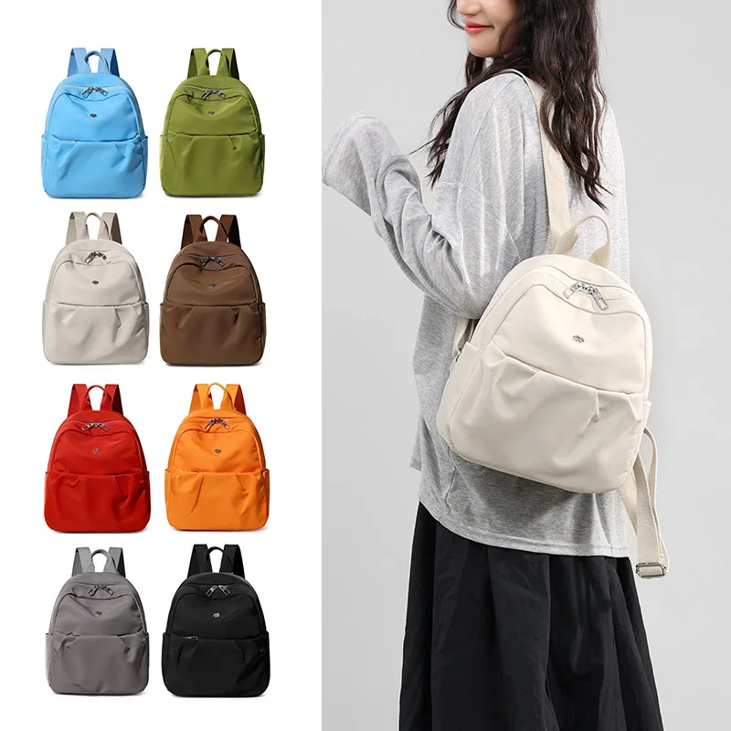 2026 New Arrival Minimalist Water Resistant Nylon Backpack Lightweight Casual School Bag Fits 12 Inch Laptop Portable Carry On