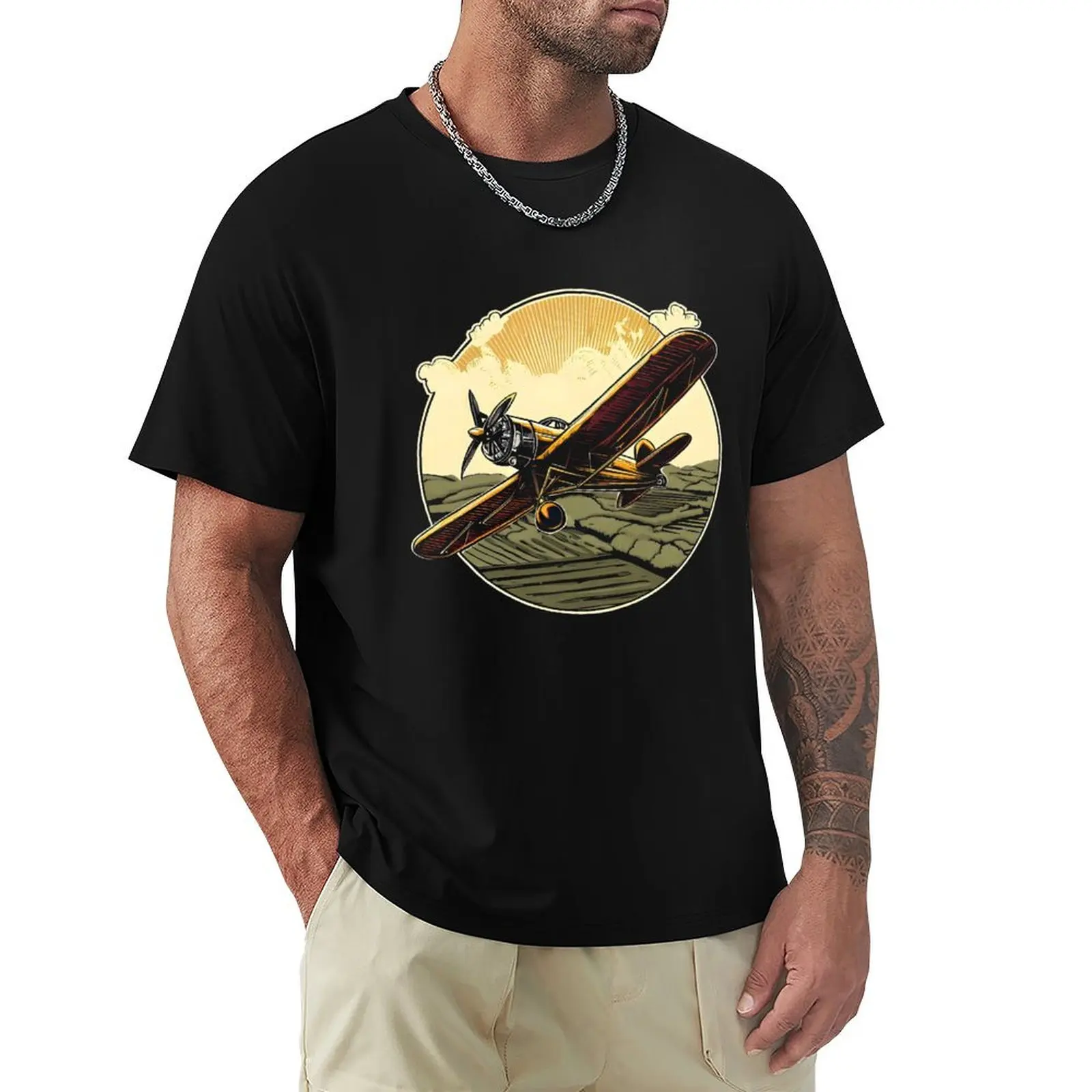 A vintage biplane soaring over a countryside with a propeller spinning in motion. T-Shirt Casual Daily Graphic Tee