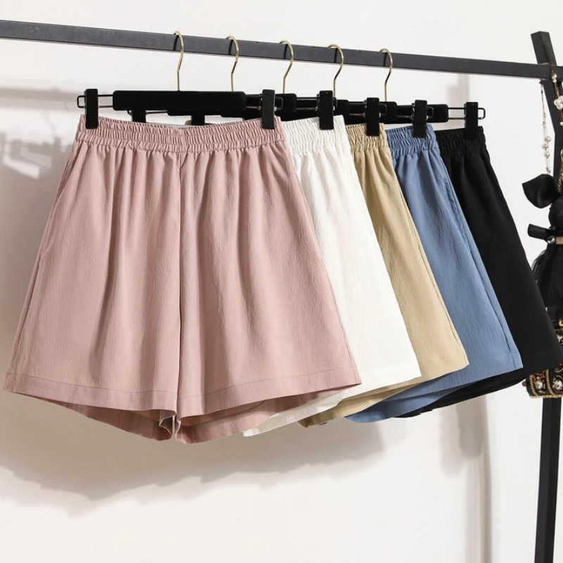 Damskie sportowe szorty z wysokim stanem, luźny krój, szerokie nogawki, jednolity kolor, kieszenie, elastyczna talia, krótkie spodnie, nowy styl 2025.