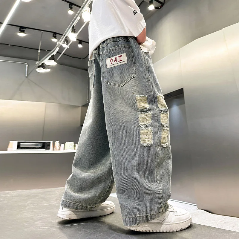 نمط جديد الأطفال فضفاض مستقيم دمرت الجينز للمراهقين الصبي عادية ممزق الدينيم السراويل الكورية الاطفال موضة بنطلون سن 4-14Y