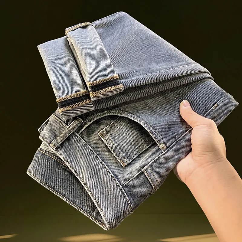 2025年春夏のメンズジーンズ、小さな足のプリント、ゆったりとしたカジュアルなストレッチデニム、ロングパンツ