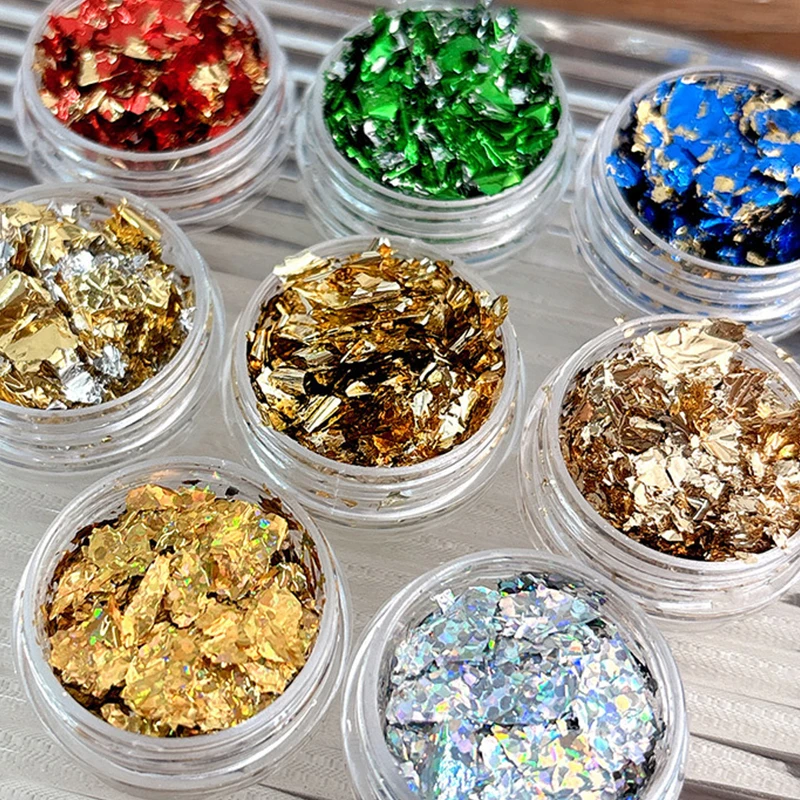 1 scatola di glitter per unghie con frammenti di lamina d'oro per adesivi per unghie fai da te Decorazioni per unghie artistiche Fiocchi di foglie d'oro multicolori